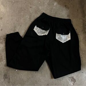 Black streetwear sweatpants with silver detailing